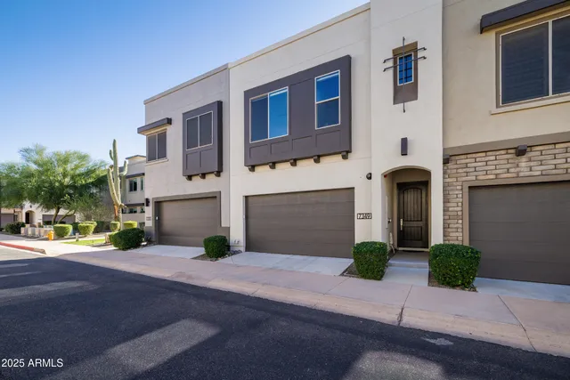 a view of a brick house with a street