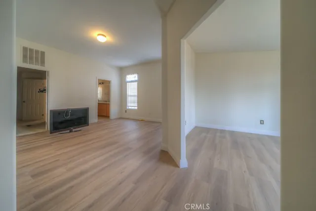 a bathroom with a granite countertop sink a toilet and mirror