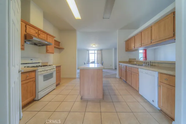 a view of an empty room and wooden floor