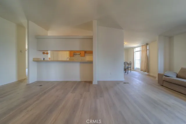 a bathroom with a granite countertop sink a toilet and a mirror