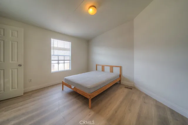 a view of a dry yard with mountains in the background