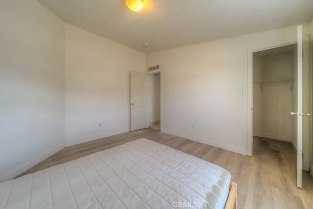 a view of empty room with wooden ceiling