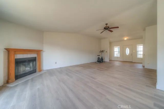 a view of a room with wooden floor