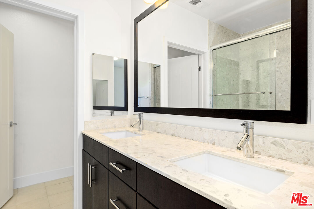 12920 West Runway Road, Unit 222 Playa Vista, CA 90094 - Photo 13 of 23 a bathroom with a sink and a mirror