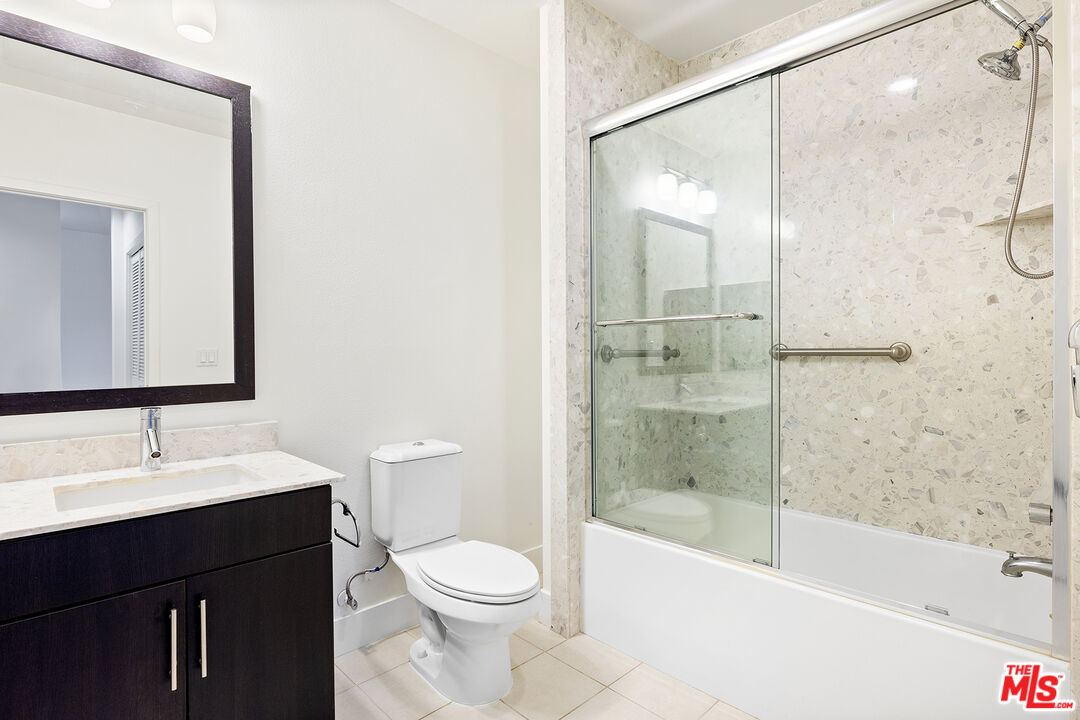 12920 West Runway Road, Unit 222 Playa Vista, CA 90094 - Photo 16 of 23 a bathroom with a bathtub shower sink mirror and toilet