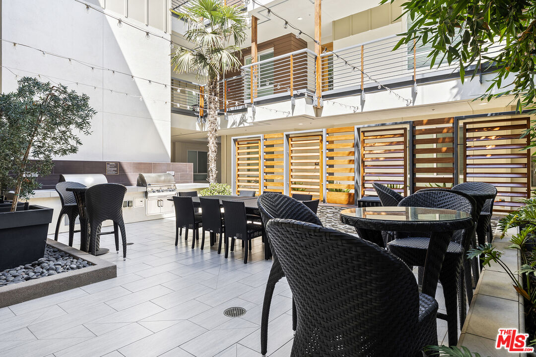 12920 West Runway Road, Unit 222 Playa Vista, CA 90094 - Photo 19 of 23 a view of a dining room with furniture window and outside view