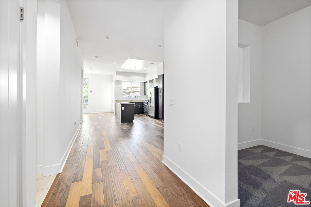 12920 West Runway Road, Unit 222 Playa Vista, CA 90094 - Photo 5 of 23 a view of a hallway with wooden floor and staircase