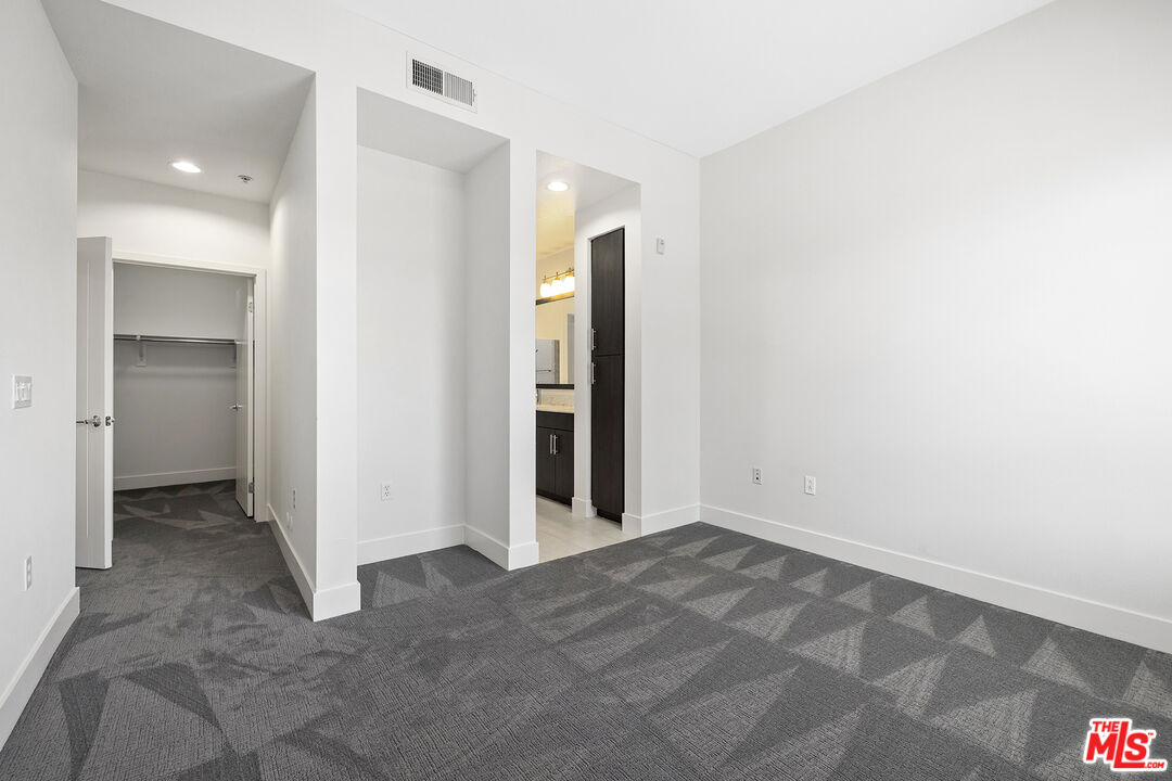 12920 West Runway Road, Unit 222 Playa Vista, CA 90094 - Photo 10 of 23 an empty room with closet and a bathroom