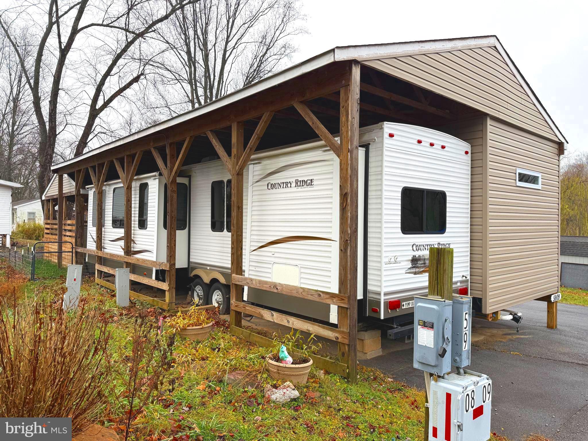 9 & 10 Jollywood Road Falling Waters, WV 25419 - Photo 4 of 10 a front view of a house with balcony