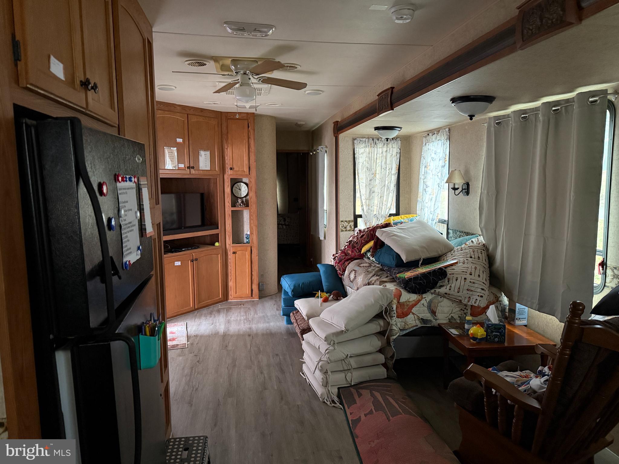 9 & 10 Jollywood Road Falling Waters, WV 25419 - Photo 7 of 10 a living room with furniture and a flat screen tv