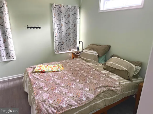 a bedroom with bed and window