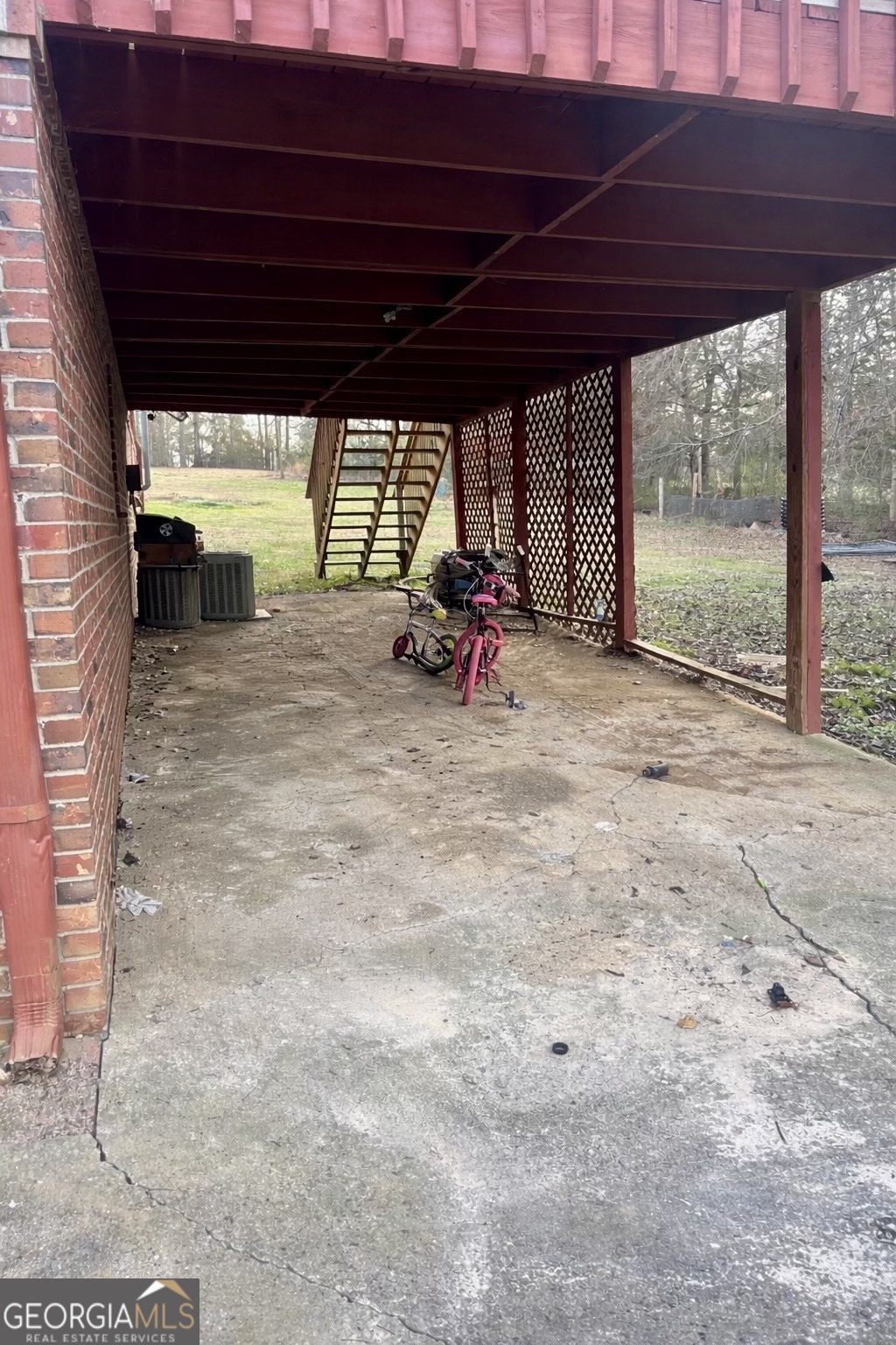 74 Hanshaw Drive Rock Spring, GA 30739 - Photo 13 of 13 a view of a room with wooden floor and roof with a barbeque grill