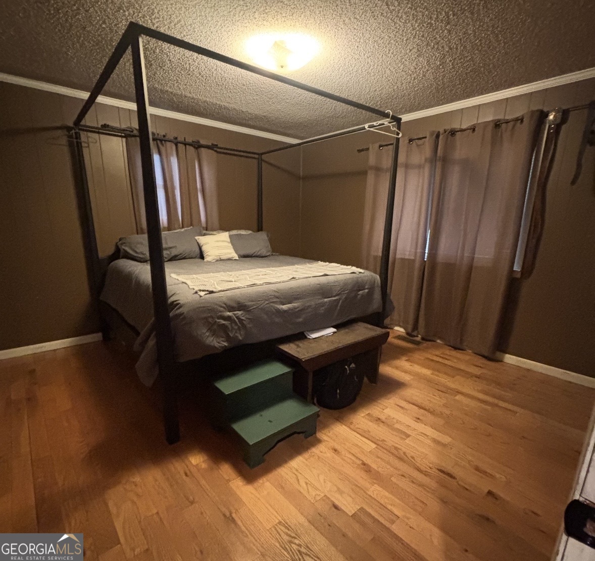 74 Hanshaw Drive Rock Spring, GA 30739 - Photo 6 of 13 a bed sitting in a bedroom next to a window