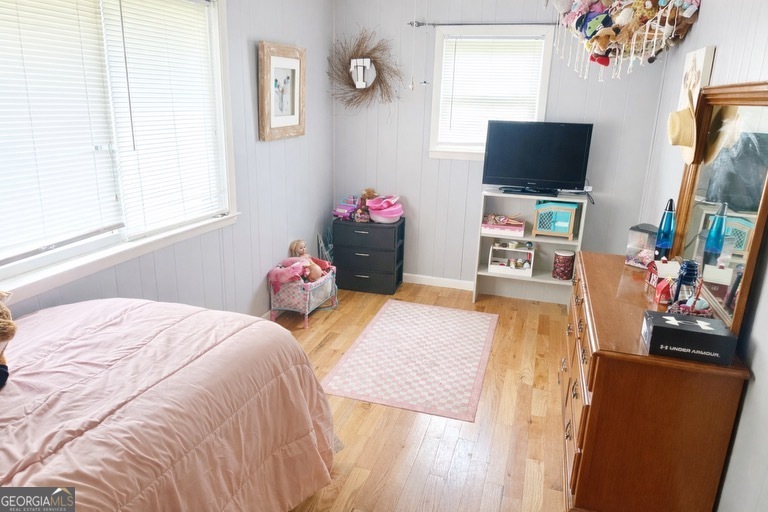 74 Hanshaw Drive Rock Spring, GA 30739 - Photo 8 of 13 a bedroom with a bed and a flat screen tv