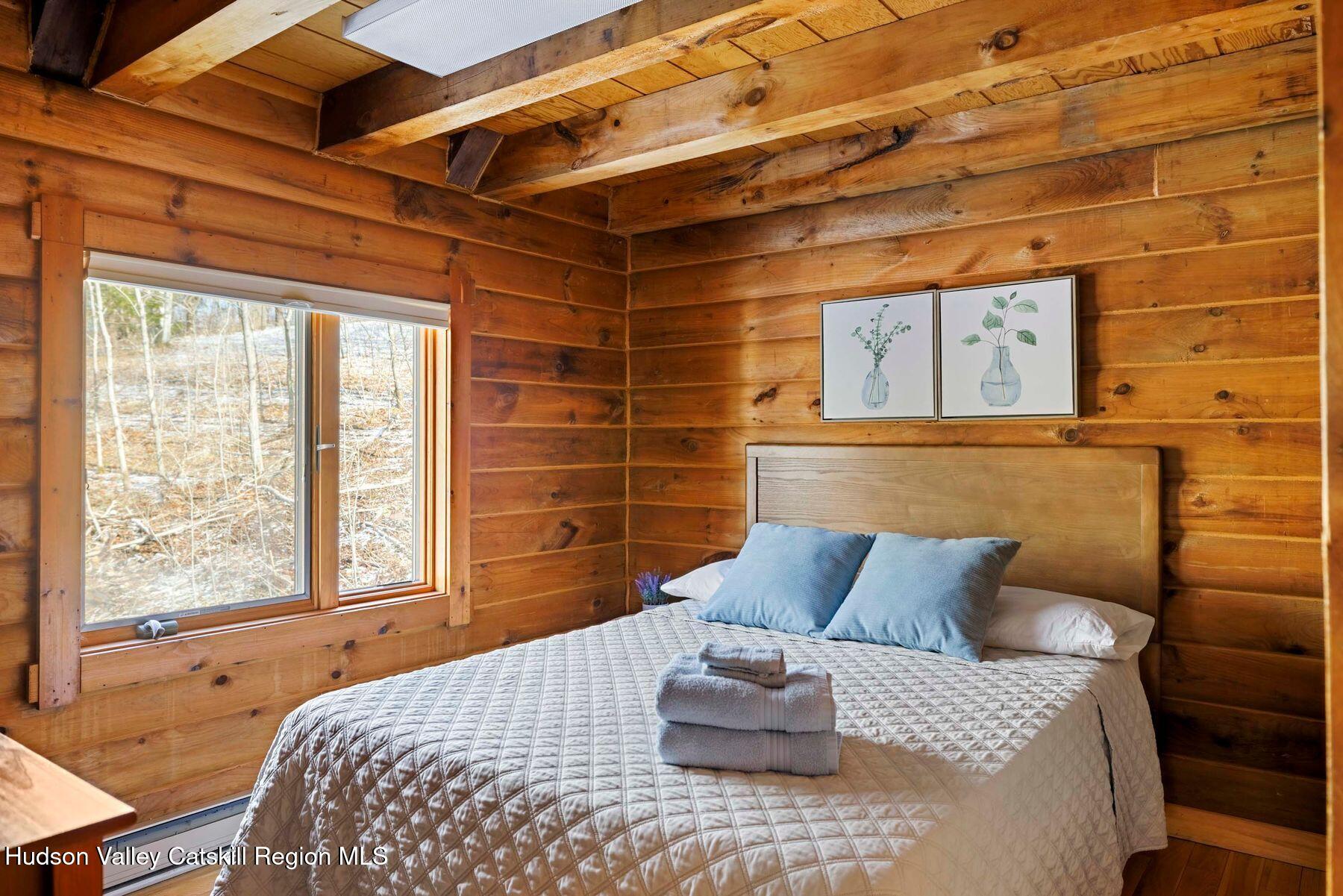 191 Mill Road Margaretville, NY 12455 - Photo 18 of 26 Primary Bedroom with Exposed Beams