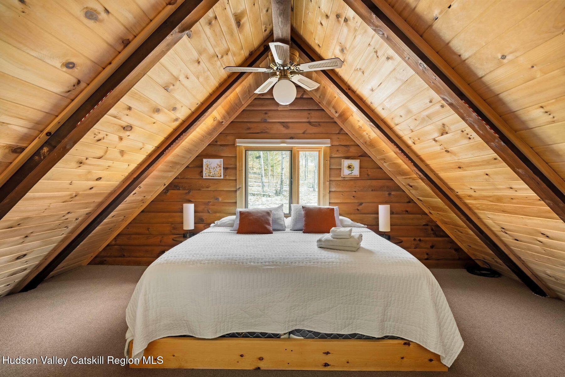 191 Mill Road Margaretville, NY 12455 - Photo 24 of 26 Loft Bedroom with Exposed Beams