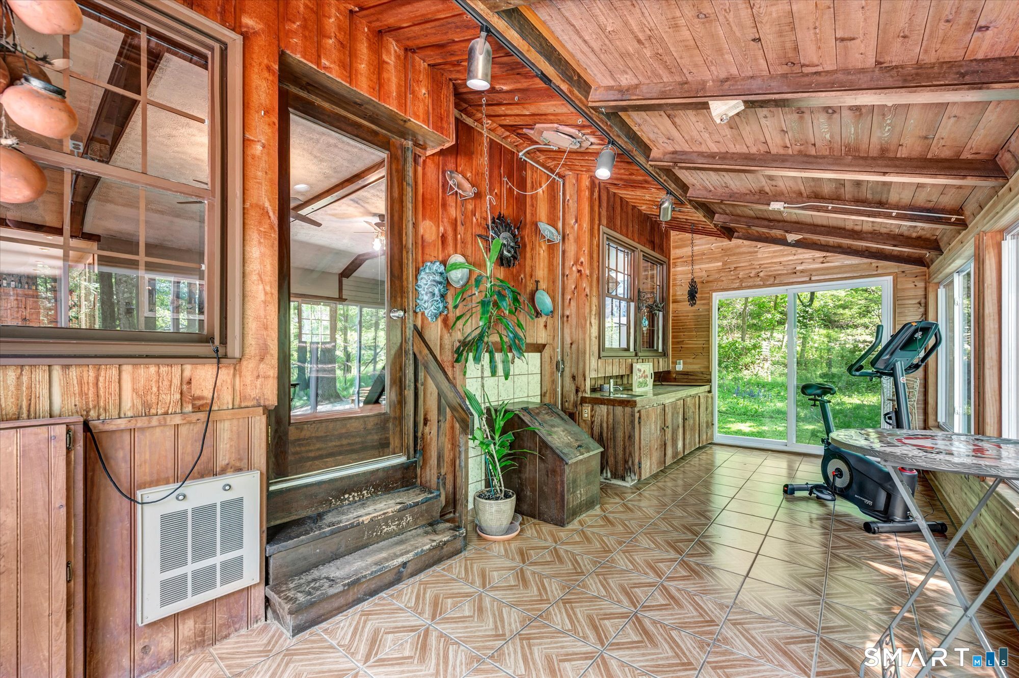 59 Indian Hill Road Canton, CT 06019 - Photo 18 of 39 a view of a porch with furniture and a potted plant