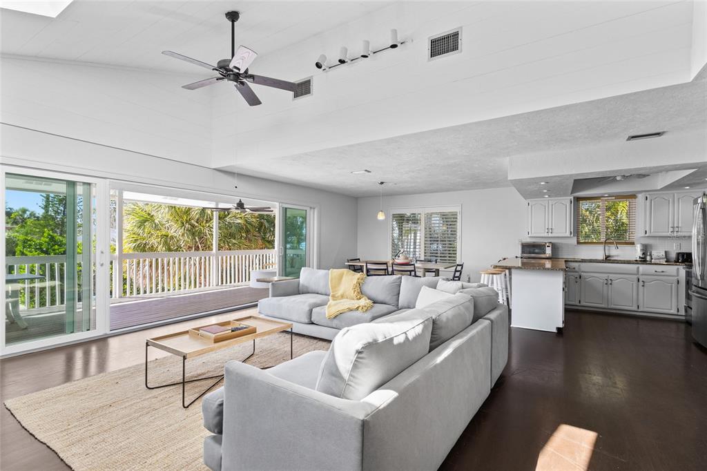 315 Spring Avenue Anna Maria, FL 34216 - Photo 6 of 63 a living room with furniture and a large window