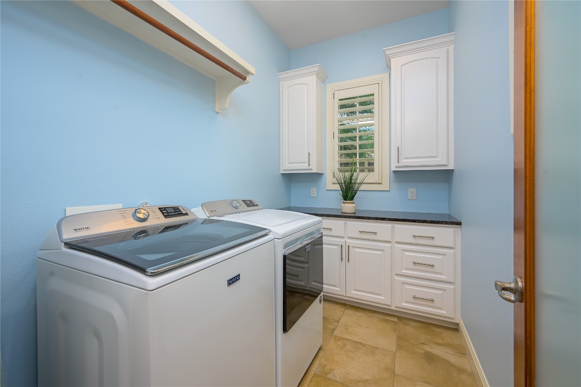 22 Borello Drive Austin, TX 78738 - Photo 14 of 26 a utility room with washer and dryer