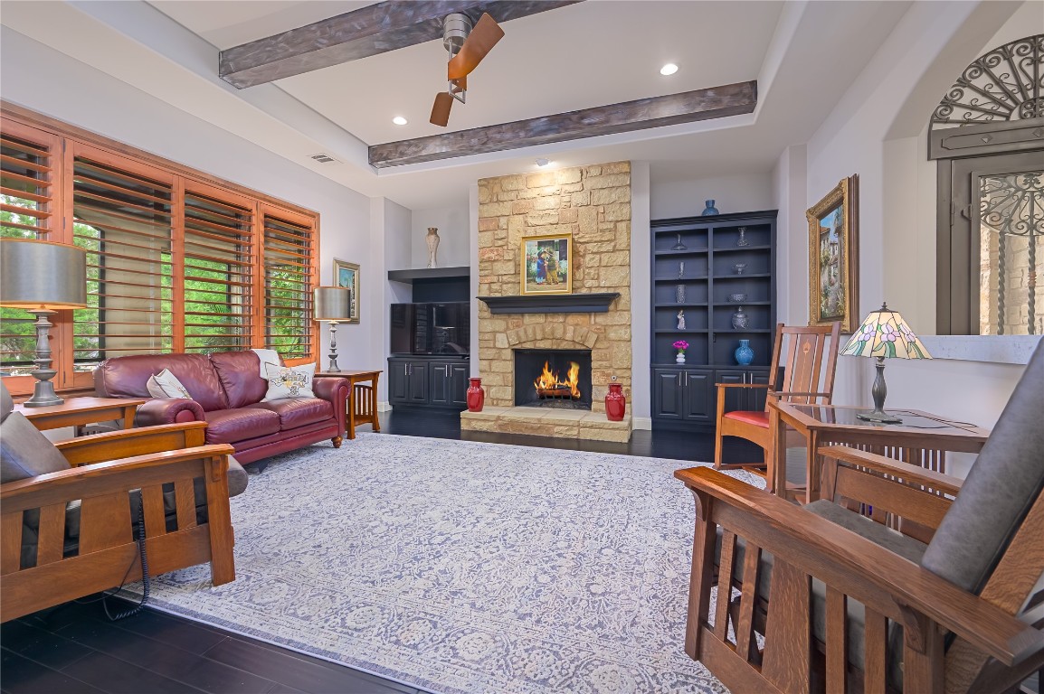 22 Borello Drive Austin, TX 78738 - Photo 16 of 26 a living room with furniture and a fireplace