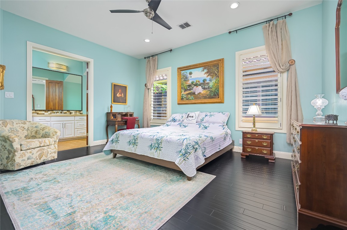 22 Borello Drive Austin, TX 78738 - Photo 17 of 26 a bedroom with a bed couch and dresser