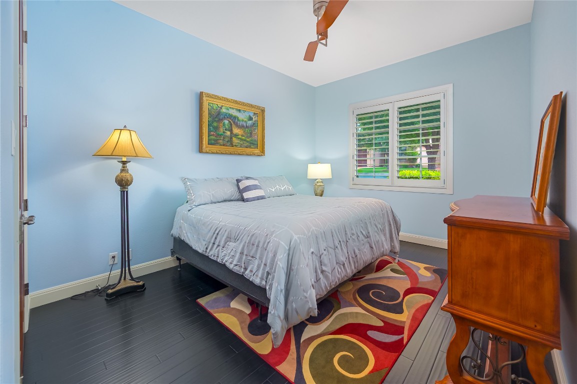 22 Borello Drive Austin, TX 78738 - Photo 20 of 26 a bedroom with bed and window