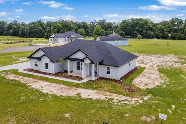 a aerial view of a house with a big yard