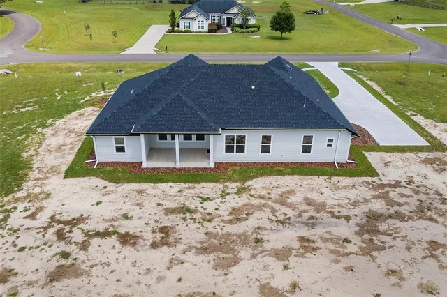 a aerial view of a house with a yard