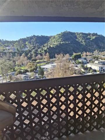 a bathroom with a granite countertop toilet and a sink