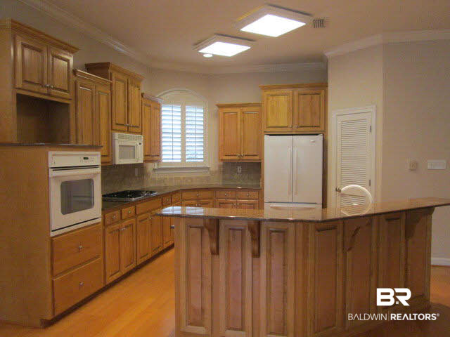 107 Chestnut Ridge Fairhope, AL 36532 - Photo 8 of 20 Super kitchen has plentiful cabinets, granite countertops and island open to living area