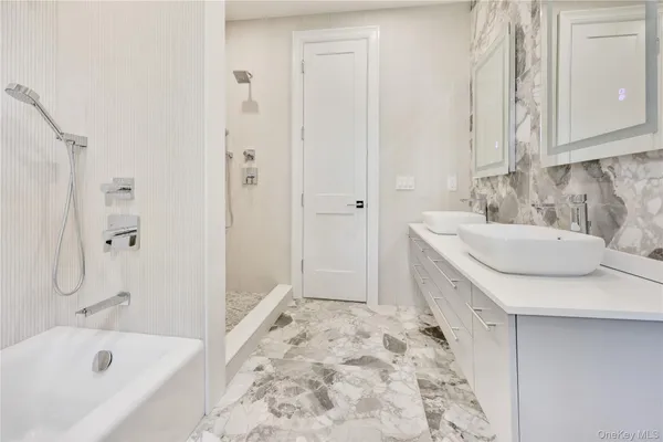 a bathroom with a sink and a bathtub