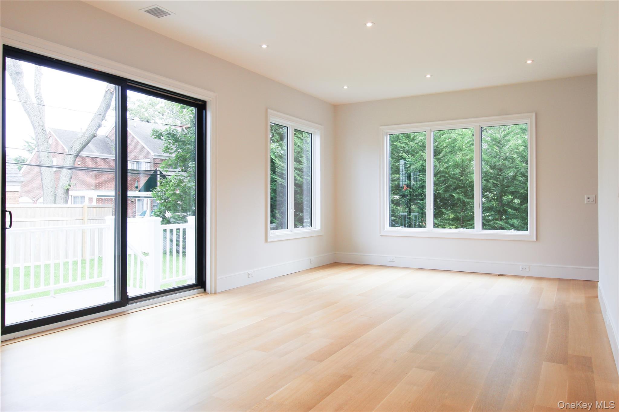 8 Sealy Drive Lawrence, NY 11559 - Photo 18 of 49 Spare room with light wood finished floors and recessed lighting