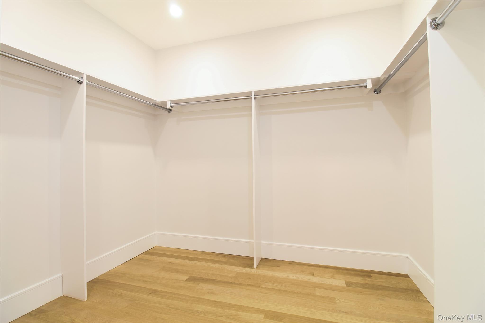 8 Sealy Drive Lawrence, NY 11559 - Photo 22 of 49 Spacious closet featuring light wood finished floors