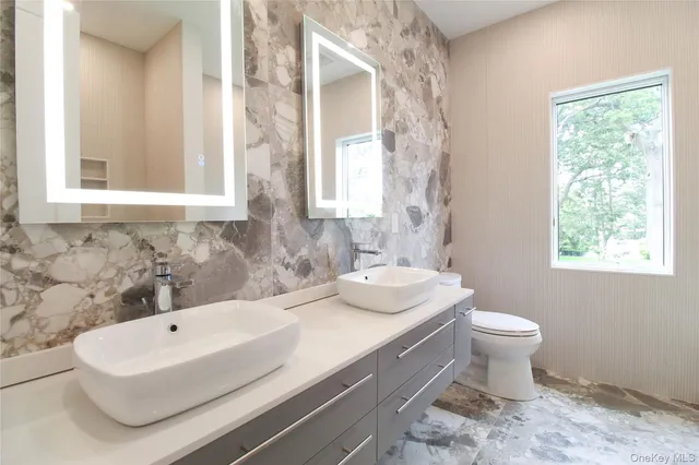 a bathroom with a sink toilet and a bathtub