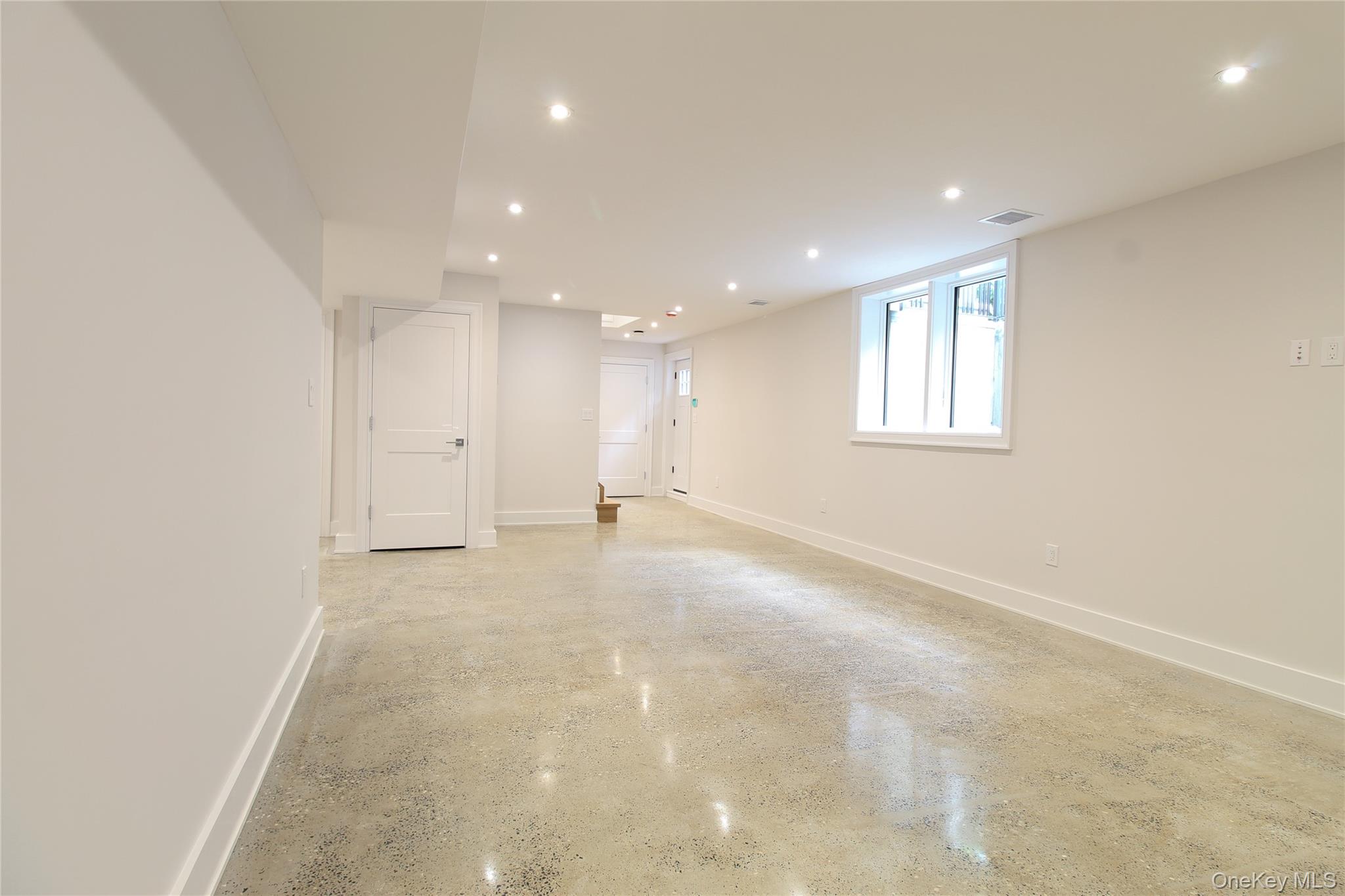 8 Sealy Drive Lawrence, NY 11559 - Photo 35 of 49 Basement with recessed lighting and baseboards