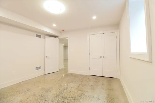 a view of backyard with swimming pool and seating area