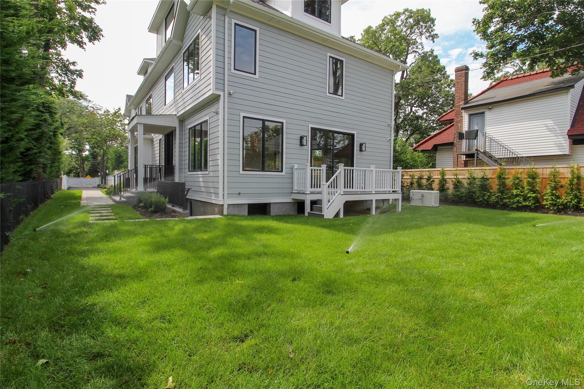 8 Sealy Drive Lawrence, NY 11559 - Photo 4 of 49 Rear view of house