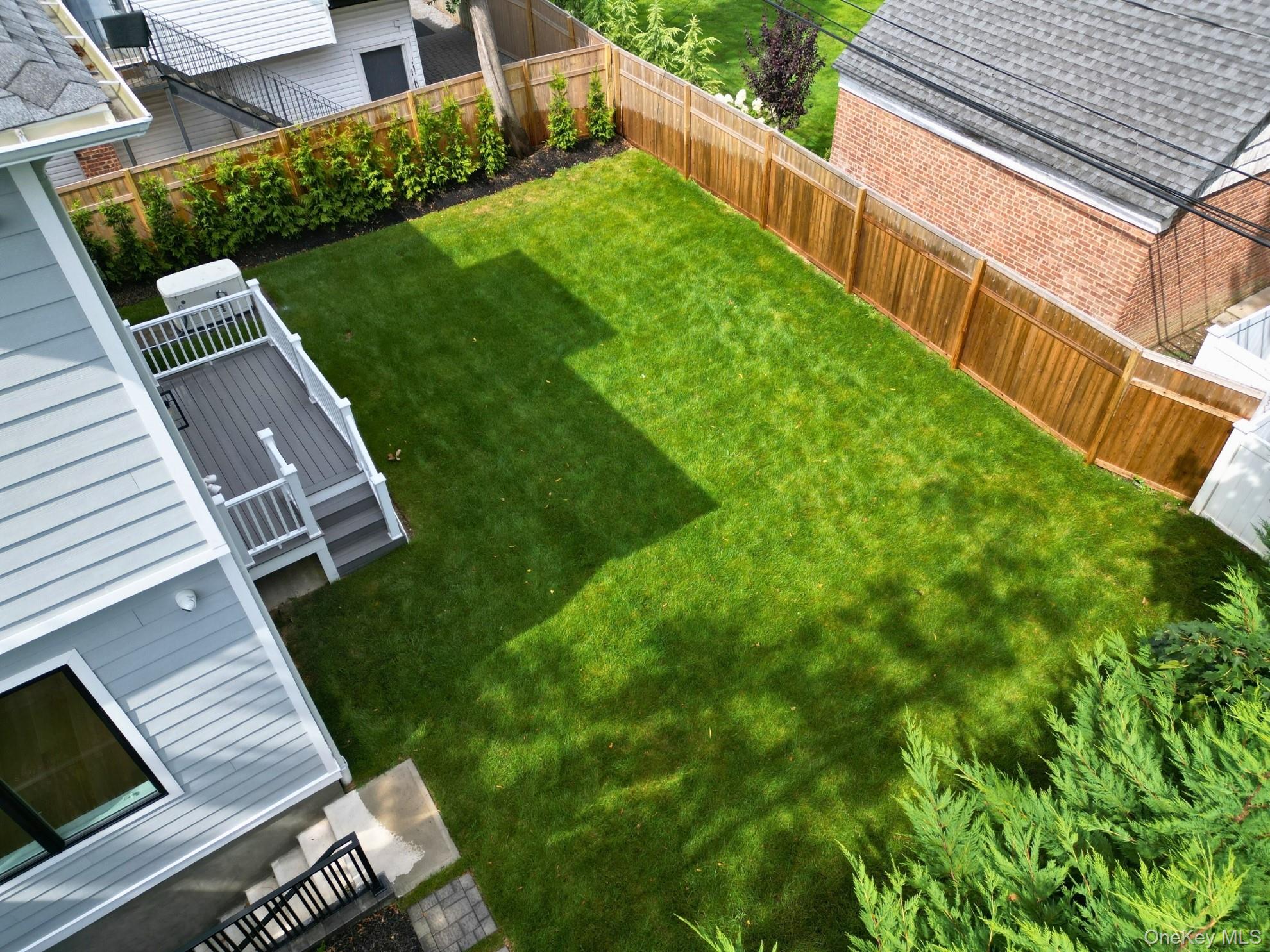 8 Sealy Drive Lawrence, NY 11559 - Photo 45 of 49 Fenced backyard featuring a patio