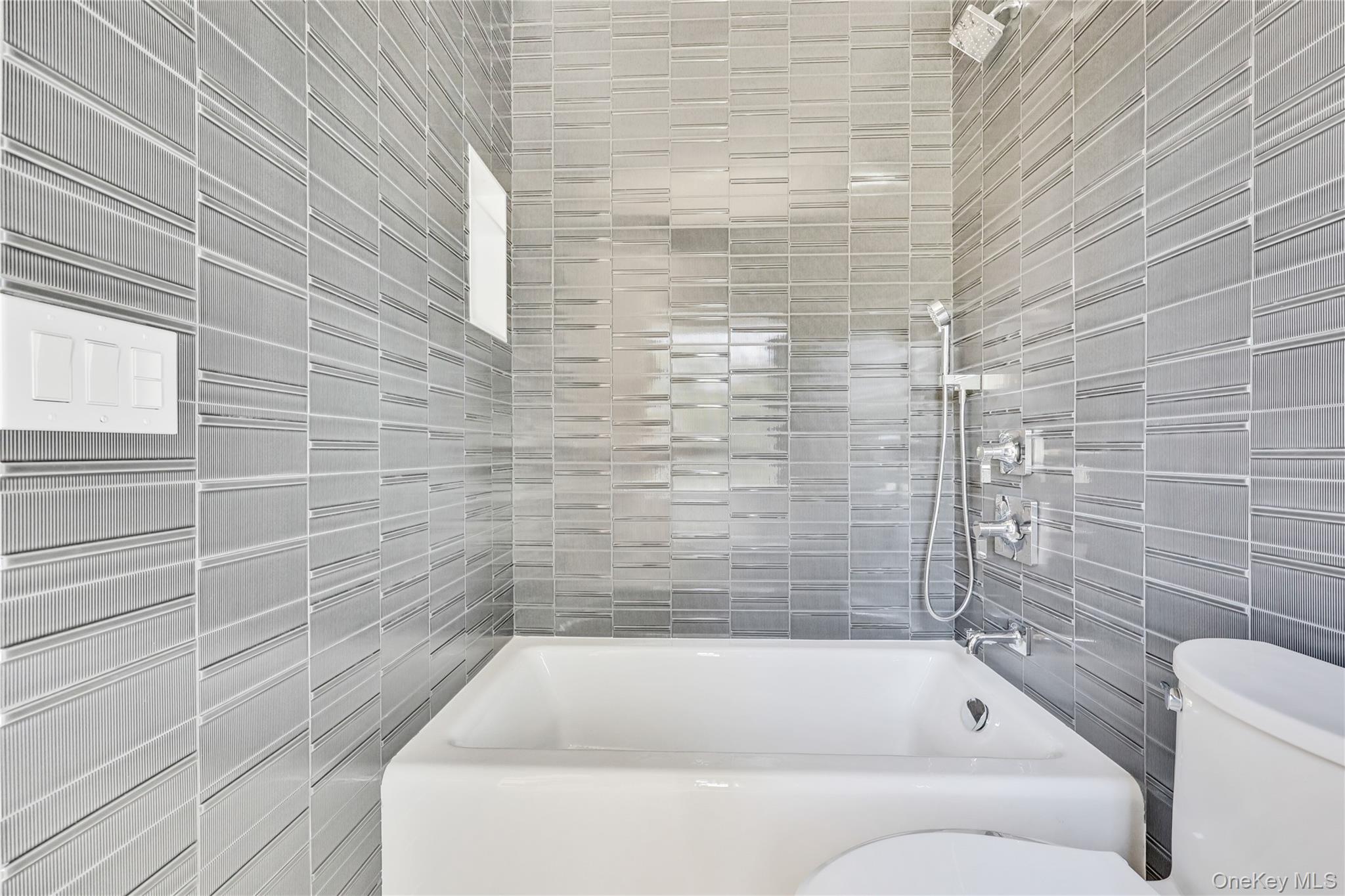 8 Sealy Drive Lawrence, NY 11559 - Photo 49 of 49 Bathroom featuring tile walls and tiled shower / bath