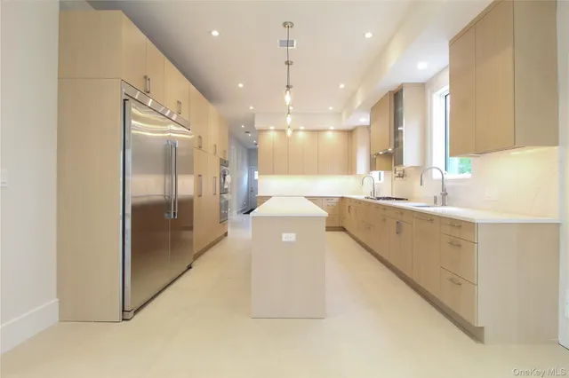 a bathroom with a sink a large mirror and a shower