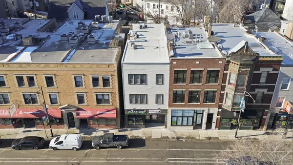 a front view of a building with street view