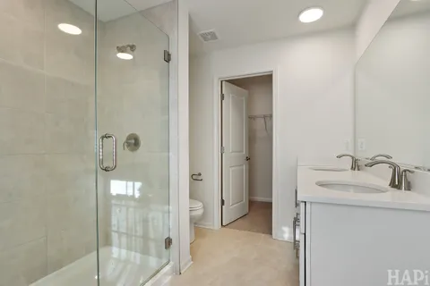 a bathroom with a granite countertop sink mirror and double