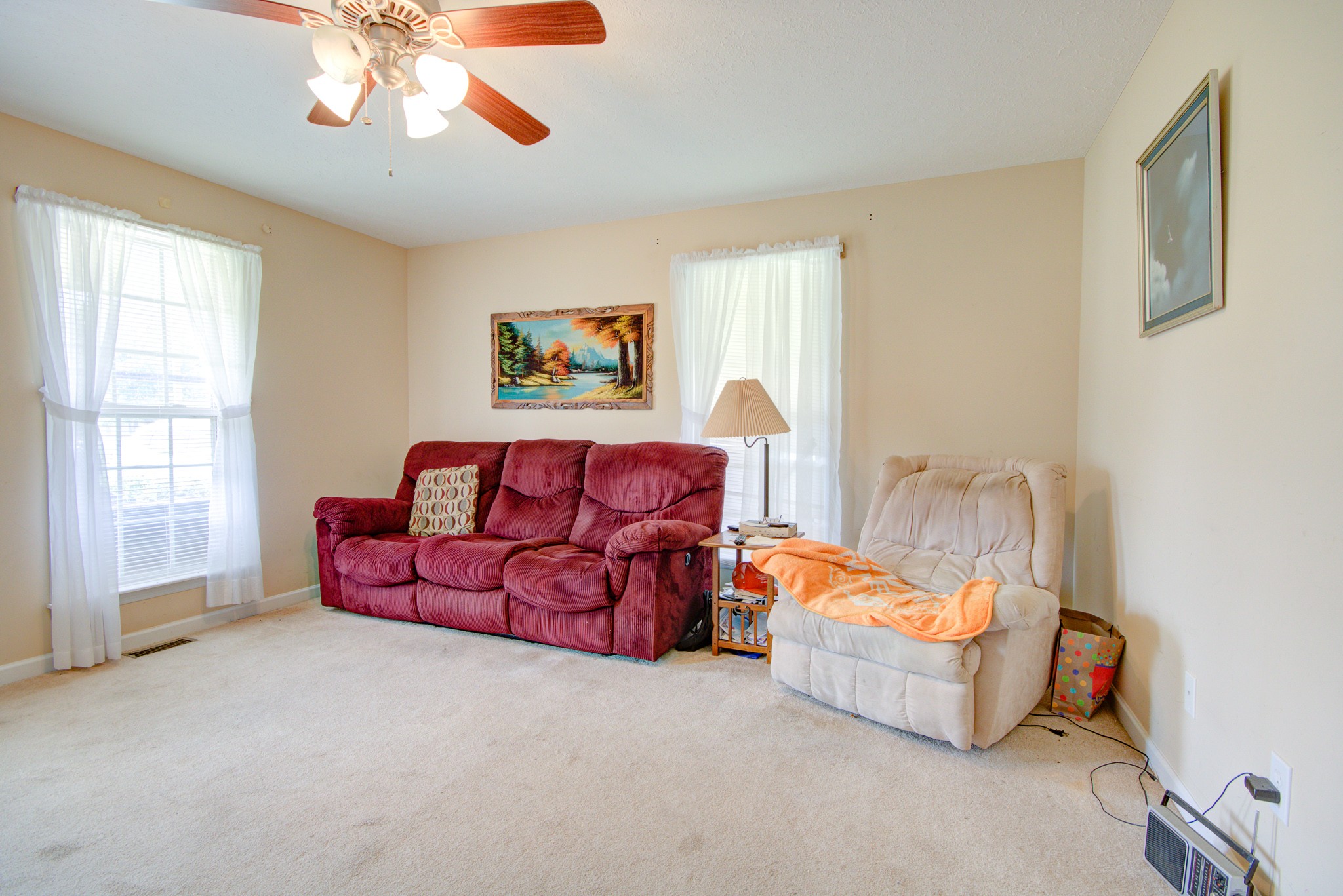 236 East Prospect Road Fayetteville, TN 37334 - Photo 9 of 29 a living room with furniture a chandelier and a flat screen tv