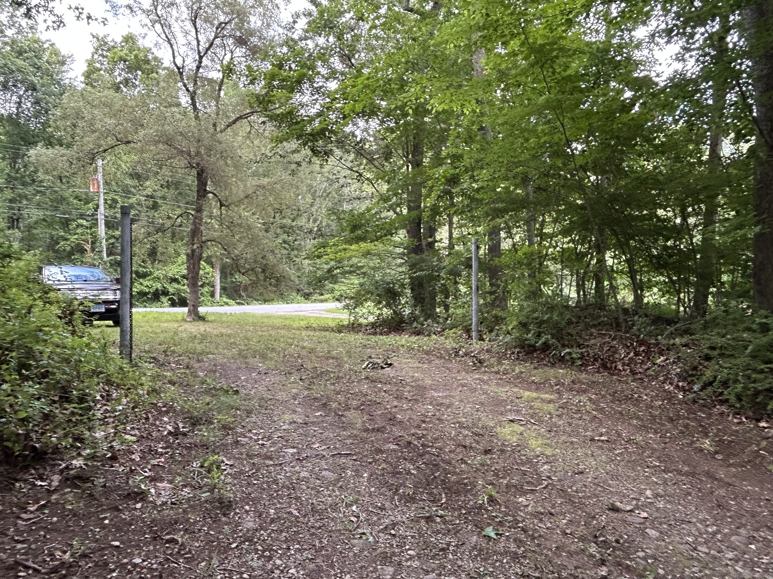 78 Salt Rock Road Sprague, CT 06330 - Photo 7 of 28 a view of outdoor space with trees all around