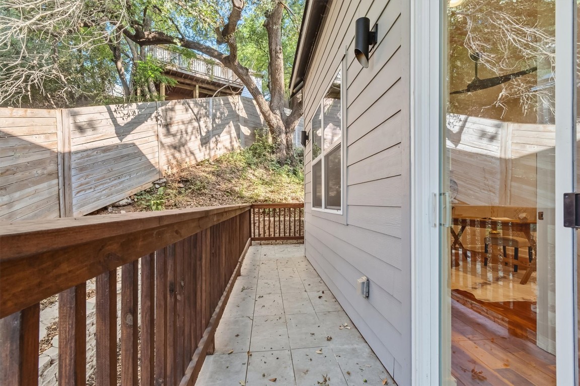 2712 Oak Springs Drive, Unit A Austin, TX 78702 - Photo 11 of 34 a view of a balcony with wooden fence and floor