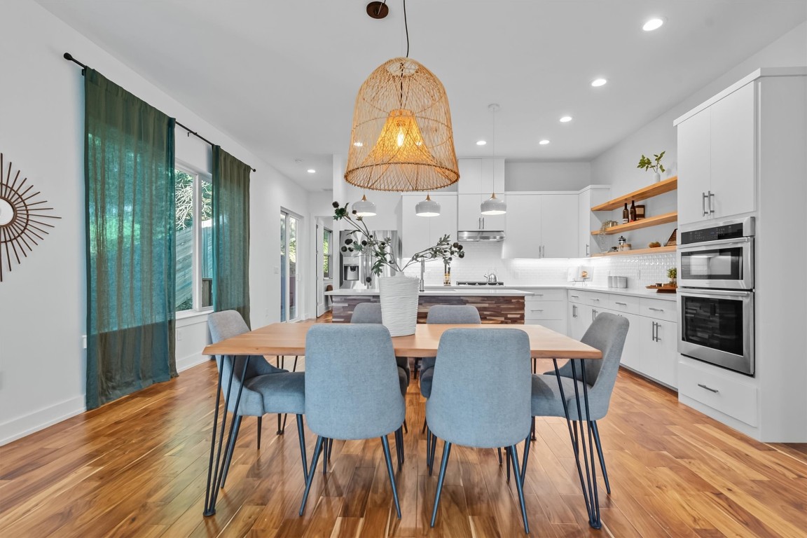 2712 Oak Springs Drive, Unit A Austin, TX 78702 - Photo 9 of 34 a view of a dining room with furniture window and wooden floor