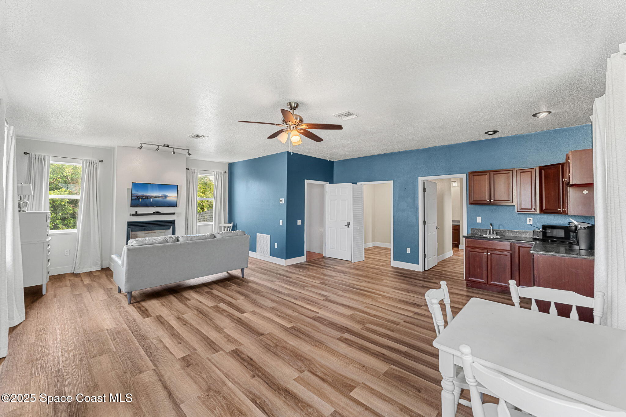 48 Harbor Circle Cocoa Beach, FL 32931 - Photo 17 of 48 a living room with stainless steel appliances kitchen island furniture and a kitchen view