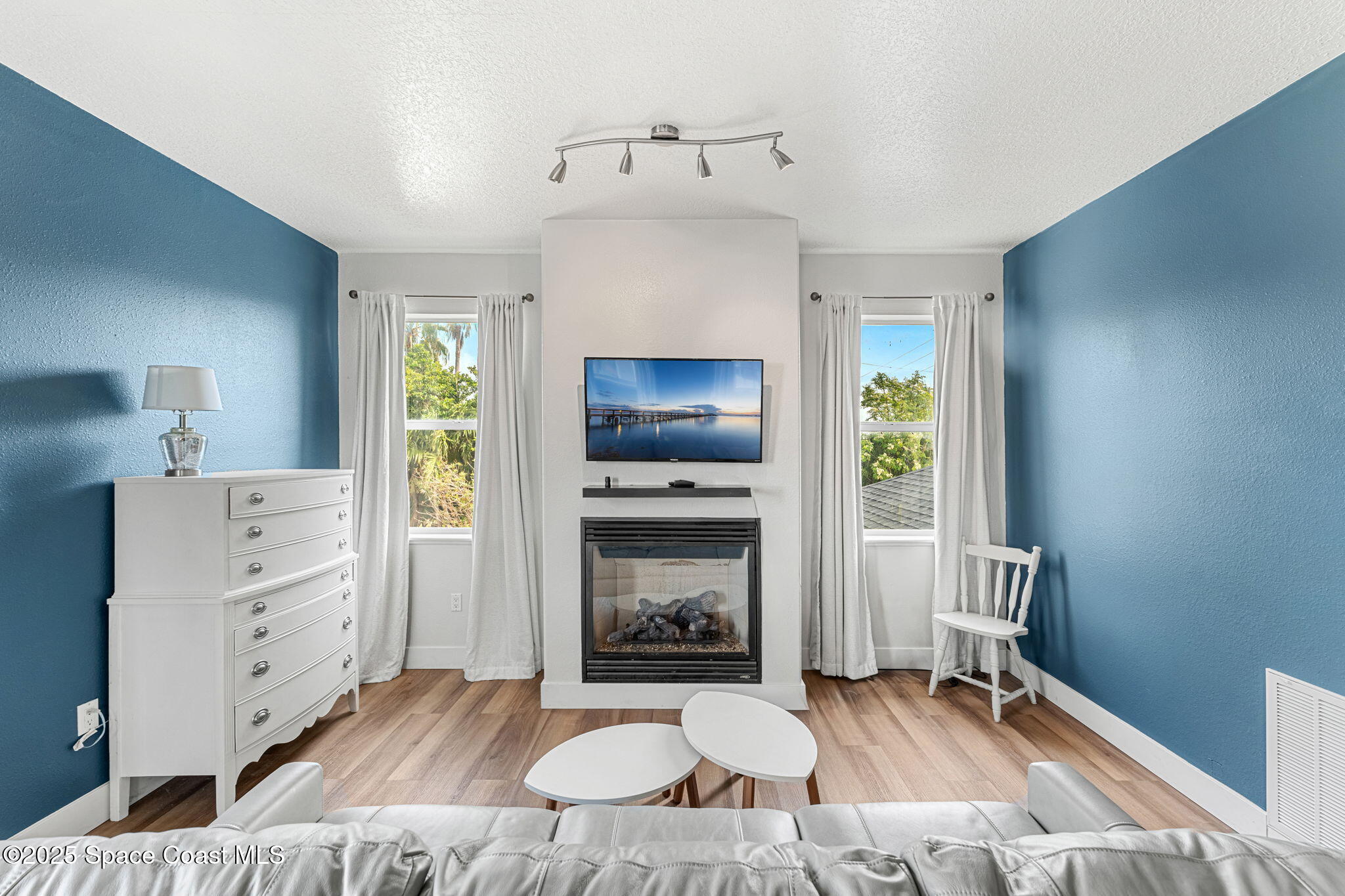 48 Harbor Circle Cocoa Beach, FL 32931 - Photo 18 of 48 a living room with furniture and a fireplace