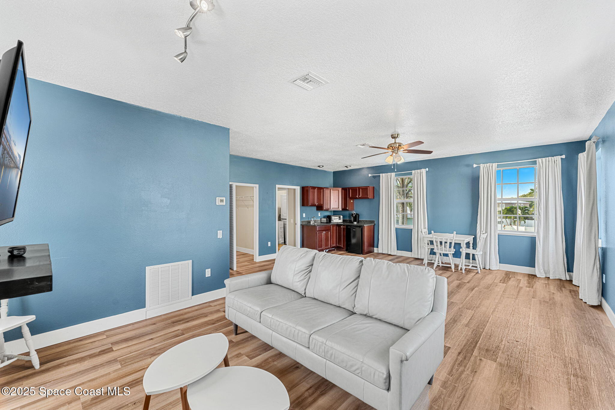 48 Harbor Circle Cocoa Beach, FL 32931 - Photo 19 of 48 a living room with furniture and a wooden floor