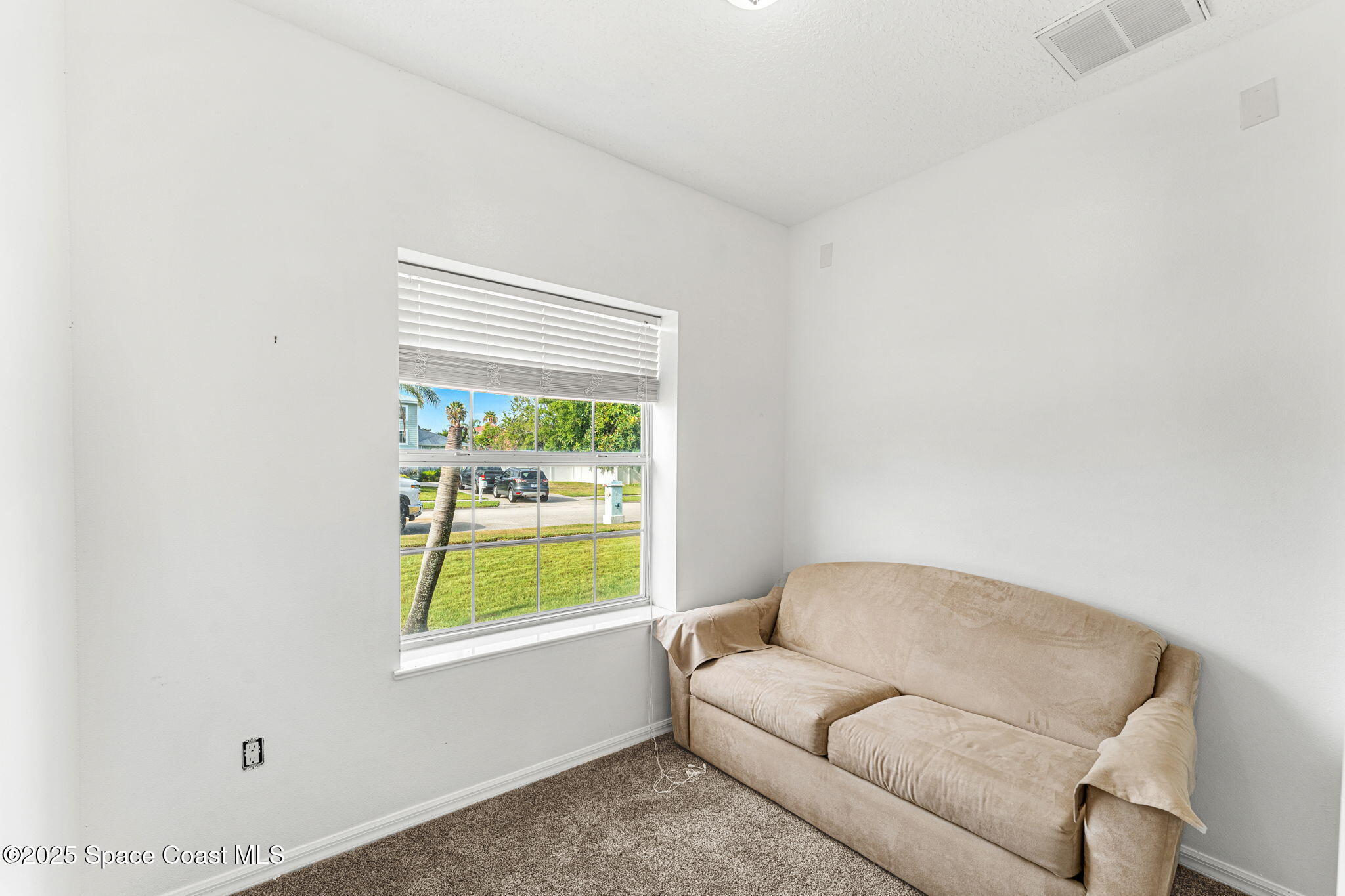 48 Harbor Circle Cocoa Beach, FL 32931 - Photo 21 of 48 a living room with furniture and a window